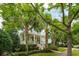 Charming home with a welcoming front porch and lush landscaping at 1407 Wando View St, Daniel Island, SC 29492