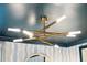 Modern light fixture on a ceiling with decorative wallpaper and trim at 1407 Wando View St, Daniel Island, SC 29492
