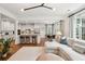 Open concept living room with view of kitchen and dining area, seamlessly connected for modern living at 1407 Wando View St, Daniel Island, SC 29492