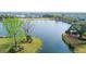 Aerial view showcasing a peaceful pond, walking paths, and the beautiful surrounding neighborhood at 1407 Wando View St, Daniel Island, SC 29492