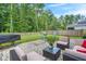 Beautiful backyard patio featuring comfortable outdoor seating and lush greenery, ideal for relaxing and entertaining guests at 141 Lagoona Dr, Summerville, SC 29483