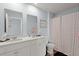 Bathroom features a double sink vanity with white cabinets and framed mirrors at 141 Lagoona Dr, Summerville, SC 29483