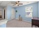 Bedroom with a ceiling fan, blue walls, carpeted floors, and a window with blinds at 141 Lagoona Dr, Summerville, SC 29483