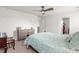 Neutral bedroom featuring a ceiling fan, carpet, dresser and view to an ensuite at 141 Lagoona Dr, Summerville, SC 29483