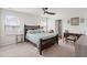 Well-lit main bedroom with a ceiling fan, windows, and neutral carpet at 141 Lagoona Dr, Summerville, SC 29483