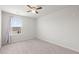 Neutral bedroom featuring a ceiling fan and a bright window for natural light at 141 Lagoona Dr, Summerville, SC 29483