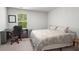 Neutral bedroom featuring a bed, desk, and window with natural light at 141 Lagoona Dr, Summerville, SC 29483