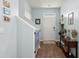 Inviting entryway featuring wood floors, staircase, console table, and wall decor at 141 Lagoona Dr, Summerville, SC 29483
