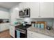 Well-equipped kitchen with granite countertops, stainless steel appliances, and ample cabinet space at 141 Lagoona Dr, Summerville, SC 29483