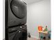 Modern laundry room featuring stacked washer and dryer units at 141 Lagoona Dr, Summerville, SC 29483