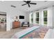 Bedroom with hardwood floors, windows with sheer curtains, and views of the lawn at 1439 Rivers Cotton Rd, Charleston, SC 29412