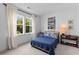 Bright bedroom with a large window, black-out curtains, neutral paint, and recessed lighting at 1439 Rivers Cotton Rd, Charleston, SC 29412