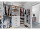 Walk-in closet with custom shelving, clothing racks, and ample storage space at 1439 Rivers Cotton Rd, Charleston, SC 29412