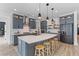 Well-equipped kitchen featuring gray cabinets, stainless steel appliances, and a large island at 1439 Rivers Cotton Rd, Charleston, SC 29412