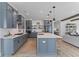 Spacious kitchen featuring gray cabinets, a center island, and stainless steel appliances at 1439 Rivers Cotton Rd, Charleston, SC 29412