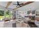 Bright, open-concept living room featuring beamed ceilings and sliding glass doors to the backyard at 1439 Rivers Cotton Rd, Charleston, SC 29412