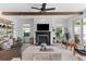 Bright living room with a fireplace, comfortable seating, and sliding doors to the outdoor space at 1439 Rivers Cotton Rd, Charleston, SC 29412