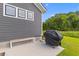 A cozy patio area features a grill, perfect for enjoying outdoor cooking and relaxation at 1439 Rivers Cotton Rd, Charleston, SC 29412