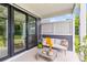 Comfortable patio space featuring a cozy seating area and view of the landscaped yard at 1439 Rivers Cotton Rd, Charleston, SC 29412