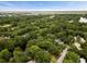 Scenic aerial view of a neighborhood with mature trees and glimpses of the bay in the distance at 1478 Diamond Blvd, Mount Pleasant, SC 29466
