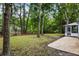 Backyard of home featuring a pond, mature trees, and gravel patio at 1478 Diamond Blvd, Mount Pleasant, SC 29466