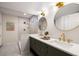 Modern bathroom features double sinks, sleek gold fixtures, and luxurious tiled shower at 1478 Diamond Blvd, Mount Pleasant, SC 29466