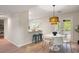 Chic dining area featuring a stylish light fixture, modern furniture, and serene views at 1478 Diamond Blvd, Mount Pleasant, SC 29466