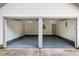 Spacious two-car garage with painted floor, interior lights, and side entry door at 1478 Diamond Blvd, Mount Pleasant, SC 29466