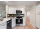 Contemporary kitchen showcasing white cabinets, stainless steel appliances, and modern fixtures at 1478 Diamond Blvd, Mount Pleasant, SC 29466