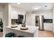 Bright kitchen featuring white cabinets, stainless steel appliances, and quartz countertops at 1478 Diamond Blvd, Mount Pleasant, SC 29466
