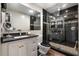 Modern bathroom featuring black tiled shower, granite countertop and black toilet at 1481 Center Street Extension # 1102, Mount Pleasant, SC 29464