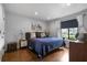 Comfortable bedroom with a large window and hardwood floors at 1481 Center Street Extension # 1102, Mount Pleasant, SC 29464