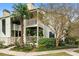 Charming condo building featuring upper and lower balconies with lush landscaping at 1481 Center Street Extension # 1102, Mount Pleasant, SC 29464
