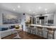 Bright kitchen with stainless appliances, a large island with seating, and a cozy living area, making for a great space at 1481 Center Street Extension # 1102, Mount Pleasant, SC 29464