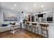 Bright kitchen with stainless appliances, a large island with seating, and a cozy living area, creating a comfortable space at 1481 Center Street Extension # 1102, Mount Pleasant, SC 29464