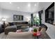 Bright living room with comfortable seating, a stylish rug, and a sliding glass door leading to an outdoor space at 1481 Center Street Extension # 1102, Mount Pleasant, SC 29464