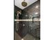 Luxurious shower featuring black tile, rainfall shower head and a built in soap niche at 1481 Center Street Extension # 1102, Mount Pleasant, SC 29464
