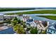 Stunning aerial view of waterfront homes showcasing lush landscaping and picturesque waterfront scenery at 1646 Marsh Harbor Ln, Mount Pleasant, SC 29464
