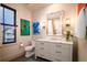 Bright bathroom featuring marble countertop vanity, tiled shower, and modern fixtures at 1646 Marsh Harbor Ln, Mount Pleasant, SC 29464