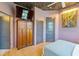 Cozy bedroom featuring a tv, wardrobe, floral wallpapered ceiling, and cool gray paint at 1646 Marsh Harbor Ln, Mount Pleasant, SC 29464