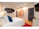 Comfortable bedroom with modern lighting fixtures, wood floors, and stylish decor at 1646 Marsh Harbor Ln, Mount Pleasant, SC 29464