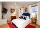 Comfortable bedroom with large windows, vibrant rug, and bright decor at 1646 Marsh Harbor Ln, Mount Pleasant, SC 29464