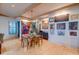 Elegant dining room with a glass table, hardwood floors, and a collection of eclectic artwork at 1646 Marsh Harbor Ln, Mount Pleasant, SC 29464