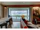 Cozy living area with a water view, comfortable seating, a bar, and access to the deck at 1646 Marsh Harbor Ln, Mount Pleasant, SC 29464