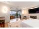 Bright primary suite with water views, fireplace, hardwood floors, and sitting area at 1646 Marsh Harbor Ln, Mount Pleasant, SC 29464