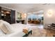 Spacious main bedroom with a seating area, water view, and a luxurious en-suite bathroom at 1646 Marsh Harbor Ln, Mount Pleasant, SC 29464