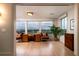 Bright home office featuring a large desk with floor to ceiling windows and scenic water views at 1646 Marsh Harbor Ln, Mount Pleasant, SC 29464