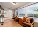 Bright home office featuring a large desk with floor to ceiling windows and scenic water views at 1646 Marsh Harbor Ln, Mount Pleasant, SC 29464