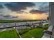 Scenic waterfront property boasting a private dock, lush greenery, and stunning sunset views at 1646 Marsh Harbor Ln, Mount Pleasant, SC 29464