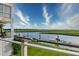 Scenic waterfront view with a private dock, boats, and lush green surroundings on a sunny day at 1646 Marsh Harbor Ln, Mount Pleasant, SC 29464